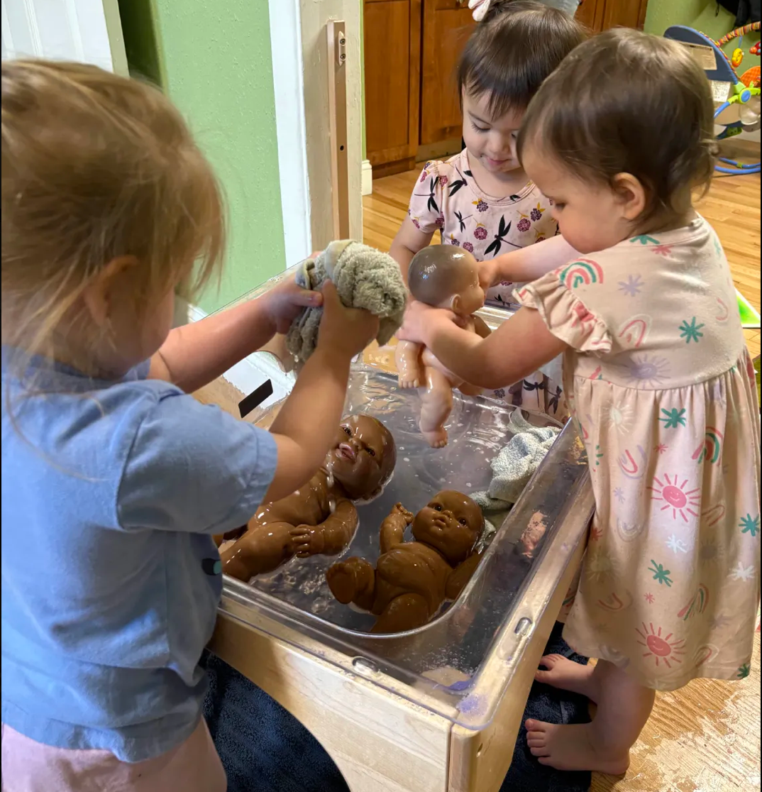 Caregiver gently holding and nurturing an infant