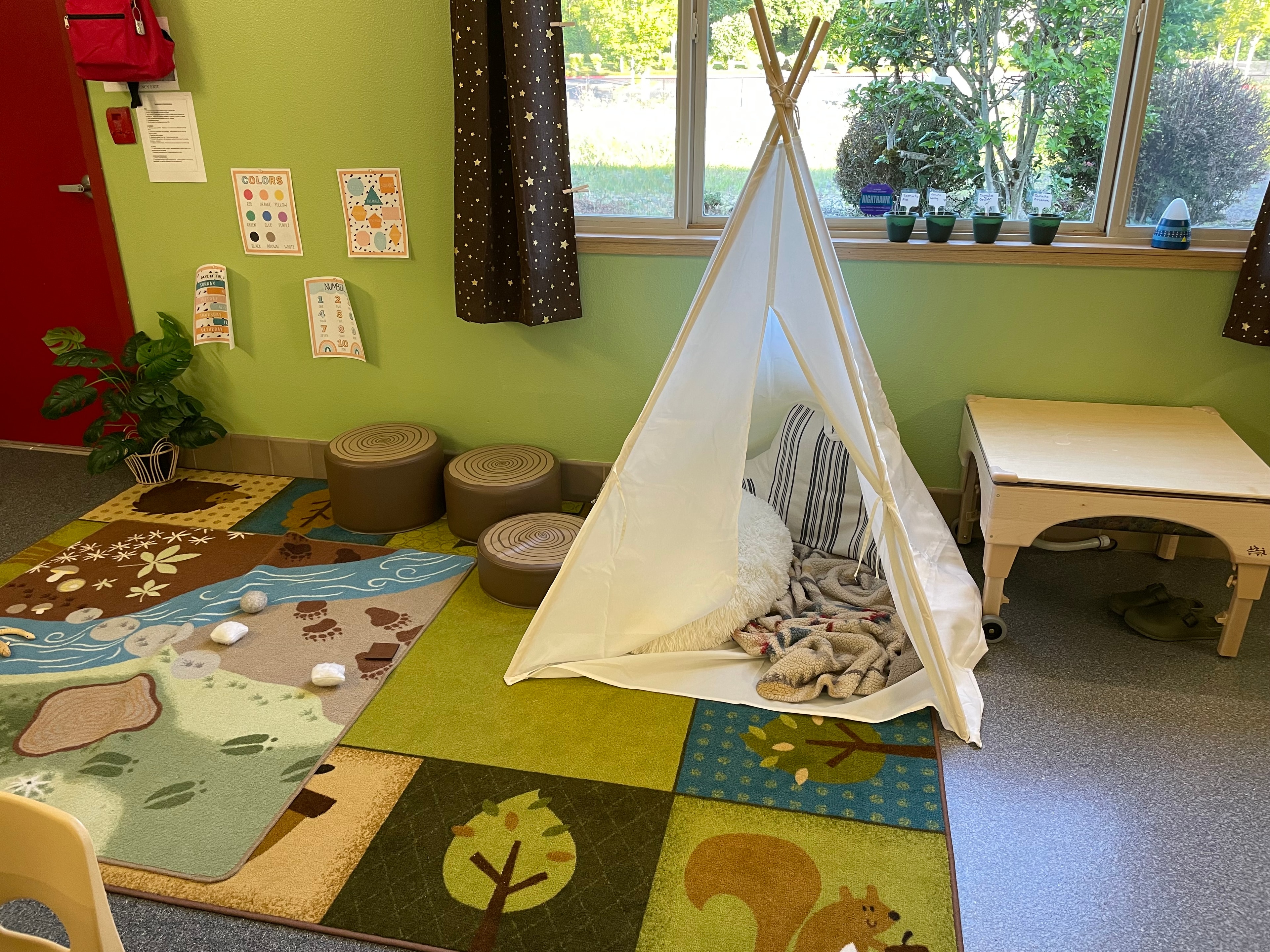 Preschool kids painting and doing crafts at a table